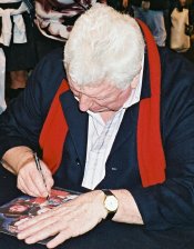 Tom Baker signing photograph