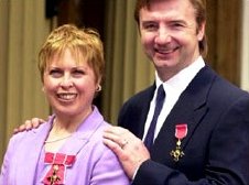 Torvill and Dean with their OBEs at Buckingham Palace