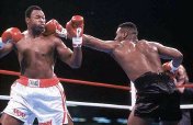 Mike Tyson defeats Larry Holmes in 1988