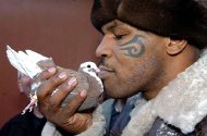 Mike Tyson with one of his pigeons
