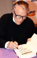 Robert Vaughn signing a copy of his autobiography 'A Fortunate Life'