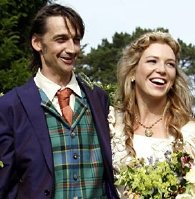 Honeysuckle Weeks and Lorne Stormonth-Darling after their wedding at Barlavington Church in Sussex