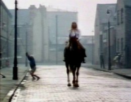 The Ragman's Daughter - Victoria Tennant rides her horse Marion along Brand Street