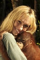 Michaela Strachan with an orang-utan on 'Orang-utan Rescue'