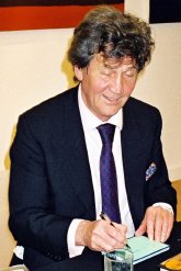 Melvyn Bragg signing autograph book
