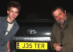 Ciaran Brown and Jethro by Jethro's Land Cruiser with its 'JESTER' number plate