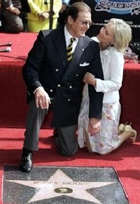 Sir Roger Moore and his wife Kiki  with his plaque on the 'Hollywood Walk Of Fame'