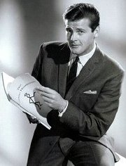 Roger Moore with a script from The Saint